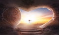 Easter concept: Empty tomb stone with cross on sunrise background Royalty Free Stock Photo