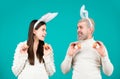 Easter family with Easter eggs. Holidays. Family celebrate Easter. Couple with eggs for Easter. Happy couple with bunny Royalty Free Stock Photo