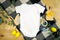 Easter farmhouse theme baby apparel top view flatlay. Mock up.