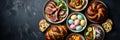 Easter feast with lamb chops, bread, colorful eggs, and assorted dishes Royalty Free Stock Photo