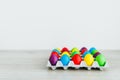 Easter festive multicolor eggs carton Royalty Free Stock Photo