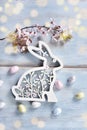 Easter flat lay with bunny shape decor and blooming branch