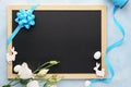 Easter frame background with chalkboard, flowers and bunny