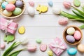 Easter frame with eggs, gift box and tulip on a colored background. The minimal concept. Top view Happy Easter Royalty Free Stock Photo