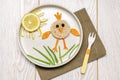 Easter funny creative healthy breakfast lunch food idea for kids, children. chicken shape sandwich from bread, peeled carrots,