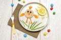 Easter funny creative healthy breakfast lunch food idea for kids, children. chicken shape sandwich from bread, peeled