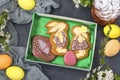 Easter gingerbread in the form of cute rabbits and eggs in a box on a dark background, Concept of the spring church holiday Royalty Free Stock Photo