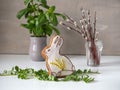 Easter gingerbread, fresh basil in a ceramic pot and a small bouquet of rosewood branches Royalty Free Stock Photo