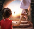 Easter and Good Friday concept, Jesus holding child's hand with empty tomb of Jesus Christ at cross on sunset background Royalty Free Stock Photo