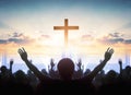 Easter and Good Friday concept, soft focus of Christian worship with raised hand on cross sunset background Royalty Free Stock Photo