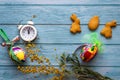 Easter greeting card concept with place for text. Colorful decorative eggs and bunny-shaped homemade cookies on a light blue Royalty Free Stock Photo