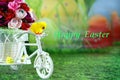 Easter greeting card with happy easter, chick on a bike with Easter eggs.