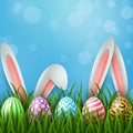 Easter greeting card with two bunny ears and colorful eggs on blue background Royalty Free Stock Photo