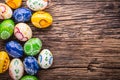 Easter. Hand made easter eggs on old wooden table