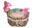 Easter handmade nest from canvas and flowers with funny blue clay bird and eggs isolated