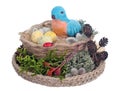 Easter handmade  nest   from rope  and  moss with  funny blue  clay bird and eggs   isolated Royalty Free Stock Photo