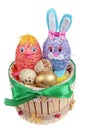 Easter handmade wooden nest with funny bunn, pink chicken and quail eggs isolated