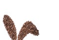 Easter holiday background with bunny ears made of freshly roasted coffee beans on a white background. Creative easter concept.