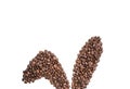 Easter holiday background with bunny ears made of freshly roasted coffee beans on a white background. Creative easter concept.