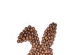 Easter holiday background with bunny ears made of freshly roasted coffee beans on a white background. Creative easter concept.