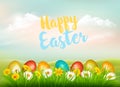 Easter Holiday Background. Colofrul eggs in green grass and colorful flowers.