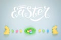 Easter holiday background with colorful shiny eggs and two yellow bunnies Royalty Free Stock Photo