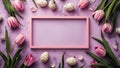 Easter holiday background with easter eggs, photo frame and tulip flowers on pink backdrop. Top view from above Royalty Free Stock Photo