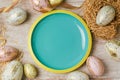 Easter holiday background with empty plate and modern eggs decorations.