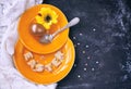 Easter holiday background, orange plate, golden eggs