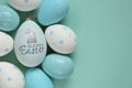 Easter holiday. Blue and white speckled Easter eggs with bunny on a blue background.Spring festive easter background in Royalty Free Stock Photo