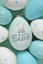Easter holiday. Blue and white speckled Easter eggs with bunny on a light blue background.Spring festive background in Royalty Free Stock Photo