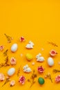 Easter holiday concept with cute handmade colorful eggs,  bunny and flowers on yellow background. Flat lay concept, top view Royalty Free Stock Photo