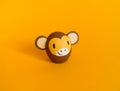 Easter holiday concept with cute handmade eggs: brown monkey