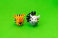 Easter holiday concept with cute handmade eggs: orange tiger and zebra