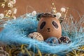 Easter holiday concept with cute handmade eggs, rabbit, chicks, owl, panda and deer. Creative eggs for Easter.