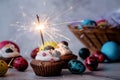 Easter cupcake with a sparkler decorated with colored quail eggs Royalty Free Stock Photo