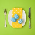 Easter holiday concept with plate and eggs decorations Royalty Free Stock Photo