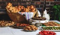 Easter holiday table with traditional bread and authentic Romanian food. Baked buns, colaci or cakes in straw baskets and towel Royalty Free Stock Photo