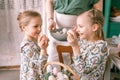 easter holiday time in spring season. happy family candid little kids sisters girls together mother mom have fun Royalty Free Stock Photo