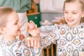 easter holiday time in spring season. happy family candid little kids sisters girls together mother mom have fun at home Royalty Free Stock Photo