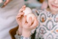 easter holiday time in spring season. traditional children hands are shackling, jarping or dumping with eggs Royalty Free Stock Photo