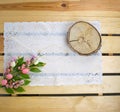 Easter holiday. White lace napkin, slice and bouquet of flowers with eggs on wooden background. Vintage background with white croc Royalty Free Stock Photo