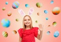 Happy girl wearing easter bunny ears waving hand Royalty Free Stock Photo