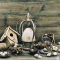 Easter home decoration with eggs, nest and birdcage Royalty Free Stock Photo