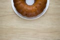 Easter homemade cake with raisins on white plate on light wooden table Royalty Free Stock Photo