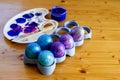 Drawing Easter Eggs at Home. Easter Holiday at Home. Blue Easter Eggs.