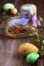 Easter lamb cake with purple ribbon, easter eggs and willow sticks Royalty Free Stock Photo