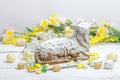 Easter lamb cake with traditional spring decor. Baked sweet dessert with icing. Festive background