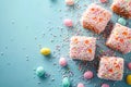 Easter lamingtons, coconut cakes on a blue background. Royalty Free Stock Photo