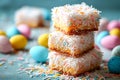 Easter lamingtons, coconut cakes on a blue background. Royalty Free Stock Photo